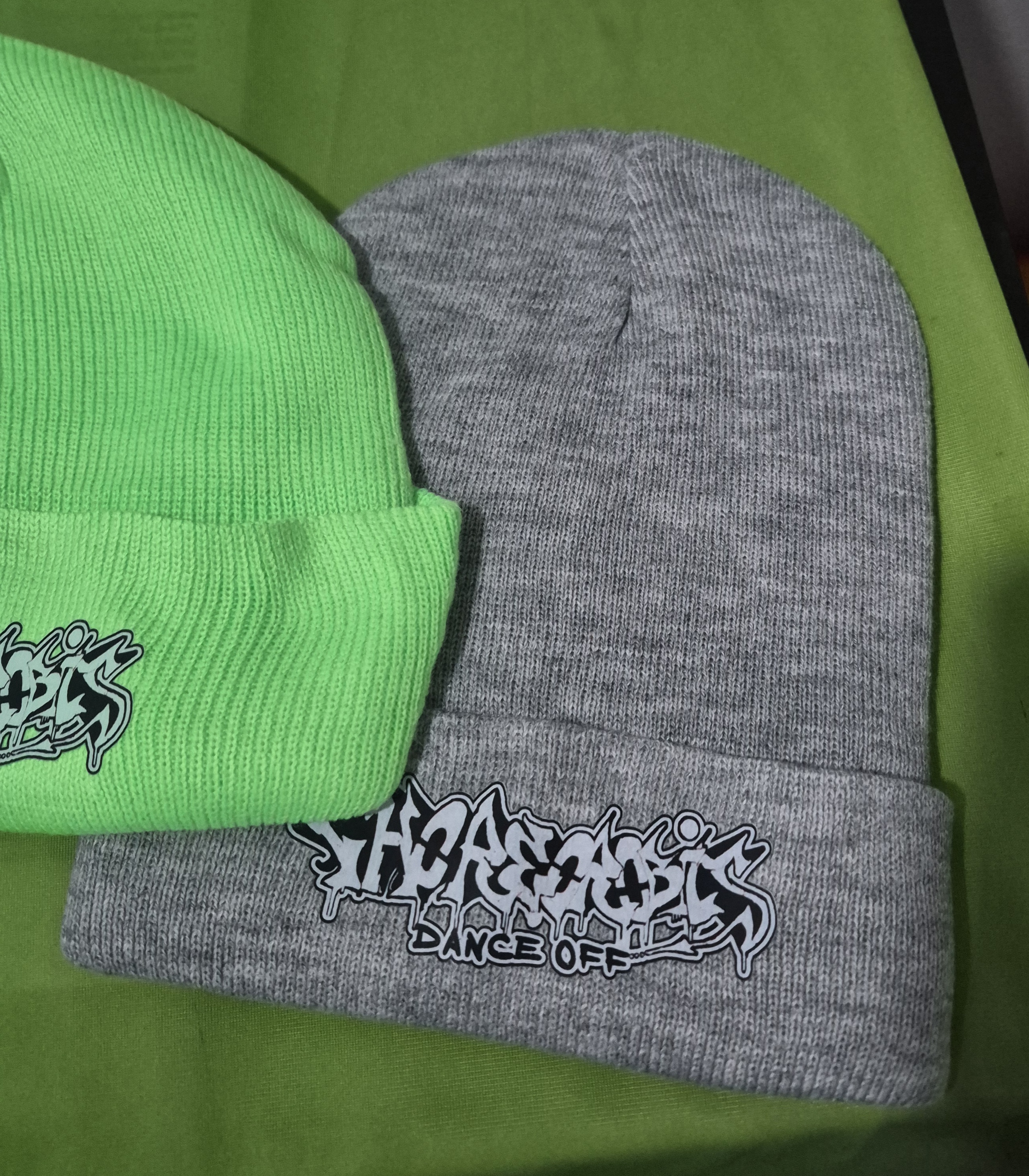 CDO! graffiti beanie cap. Great for a cute look and for cold weather dance gear. Available in black, green or gray. Polyester.