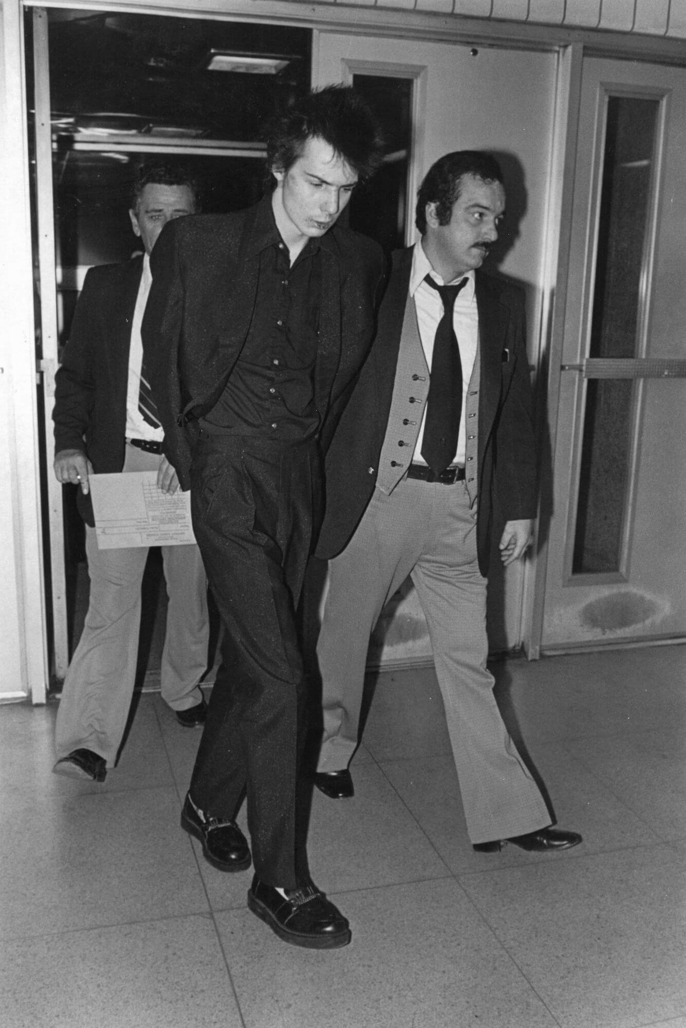 Sid Vicious Under Arrest for the Murder of Girlfriend Nancy Spungen outside the Chelsea Hotel, 1978