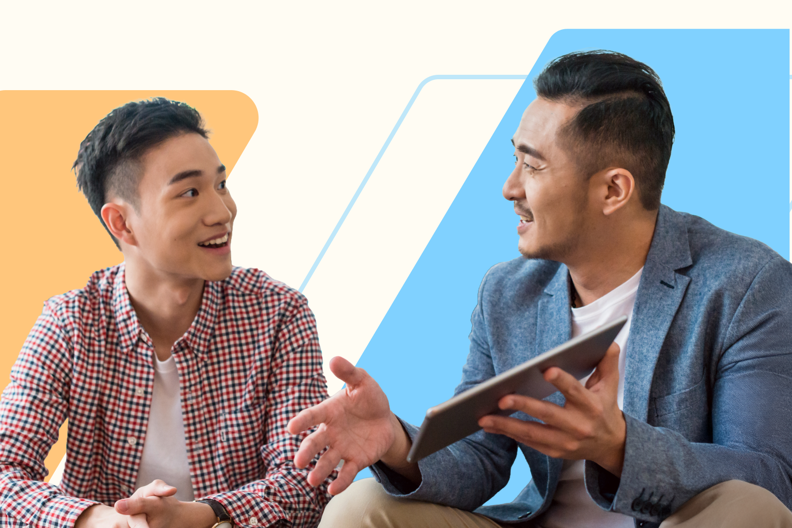 Two colleagues sit and talk in a friendly, engaged conversation. One person holds a tablet while the other smiles and listens. The background features abstract geometric shapes in orange and blue.