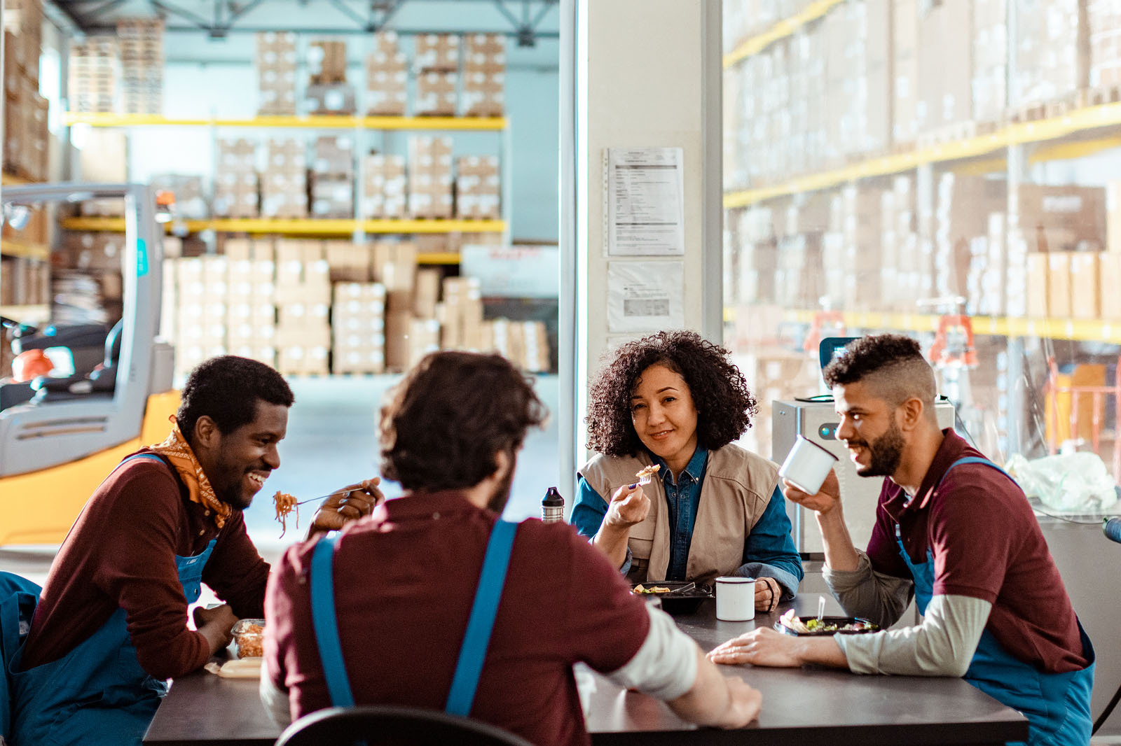A group of workers sit at a table for lunch.
