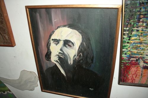 A painting of Antonin Artaud, his face and hair in black and white with streaks of color in the background, by Ernest Abuba for Ellen Stewart