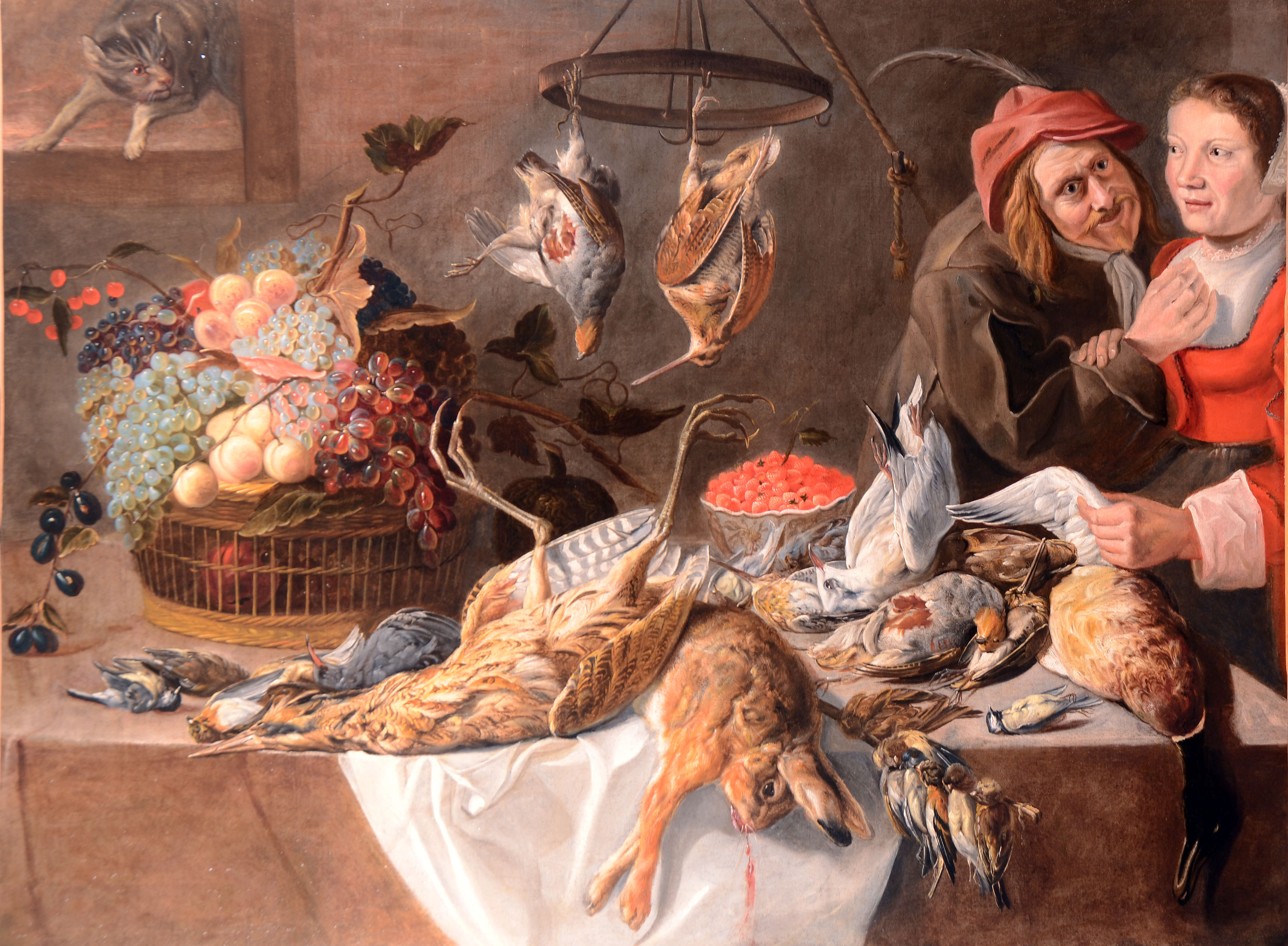  A kitchen still life with fruits and dead game