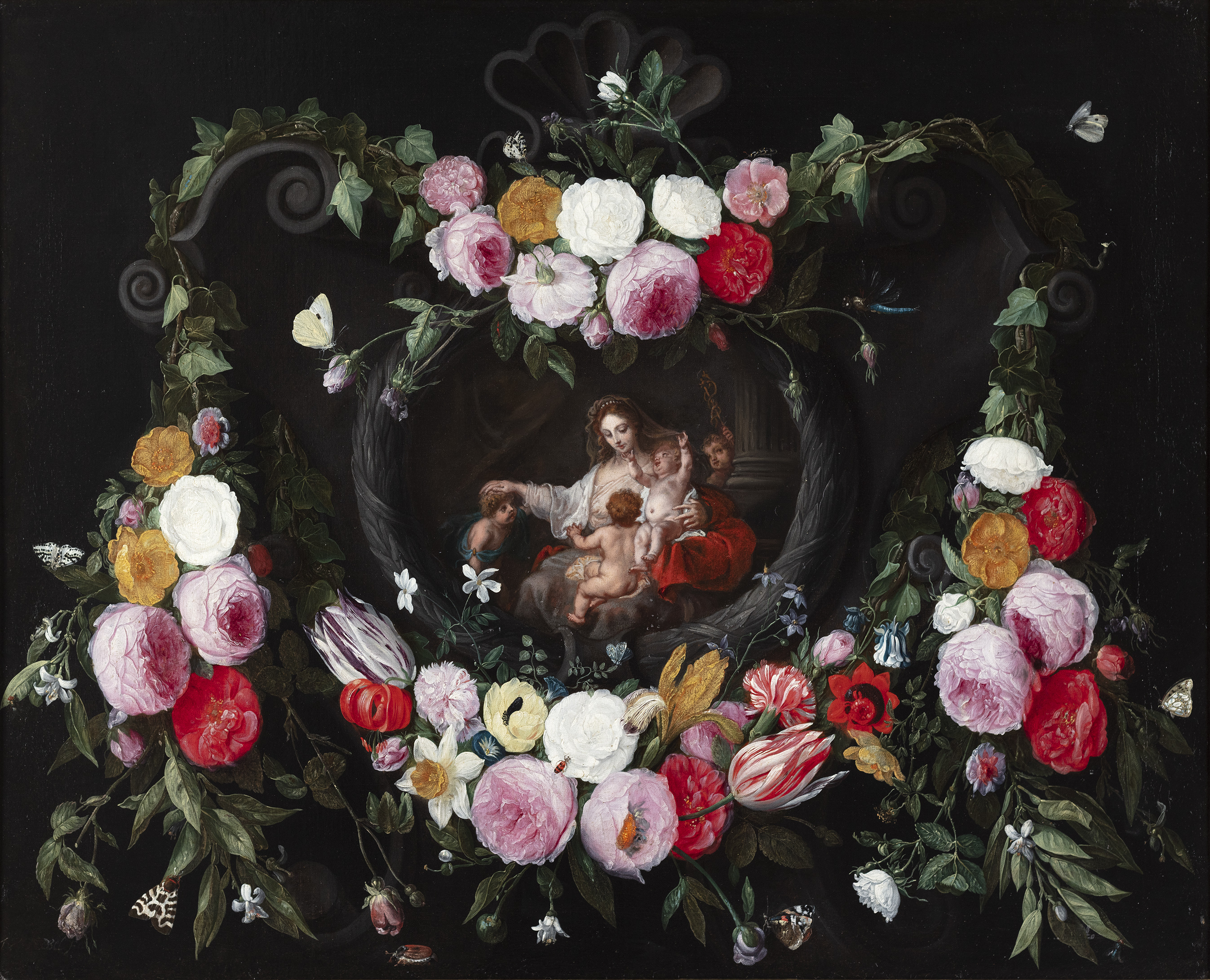 A garland of flowers with a central cartouche of Caritas