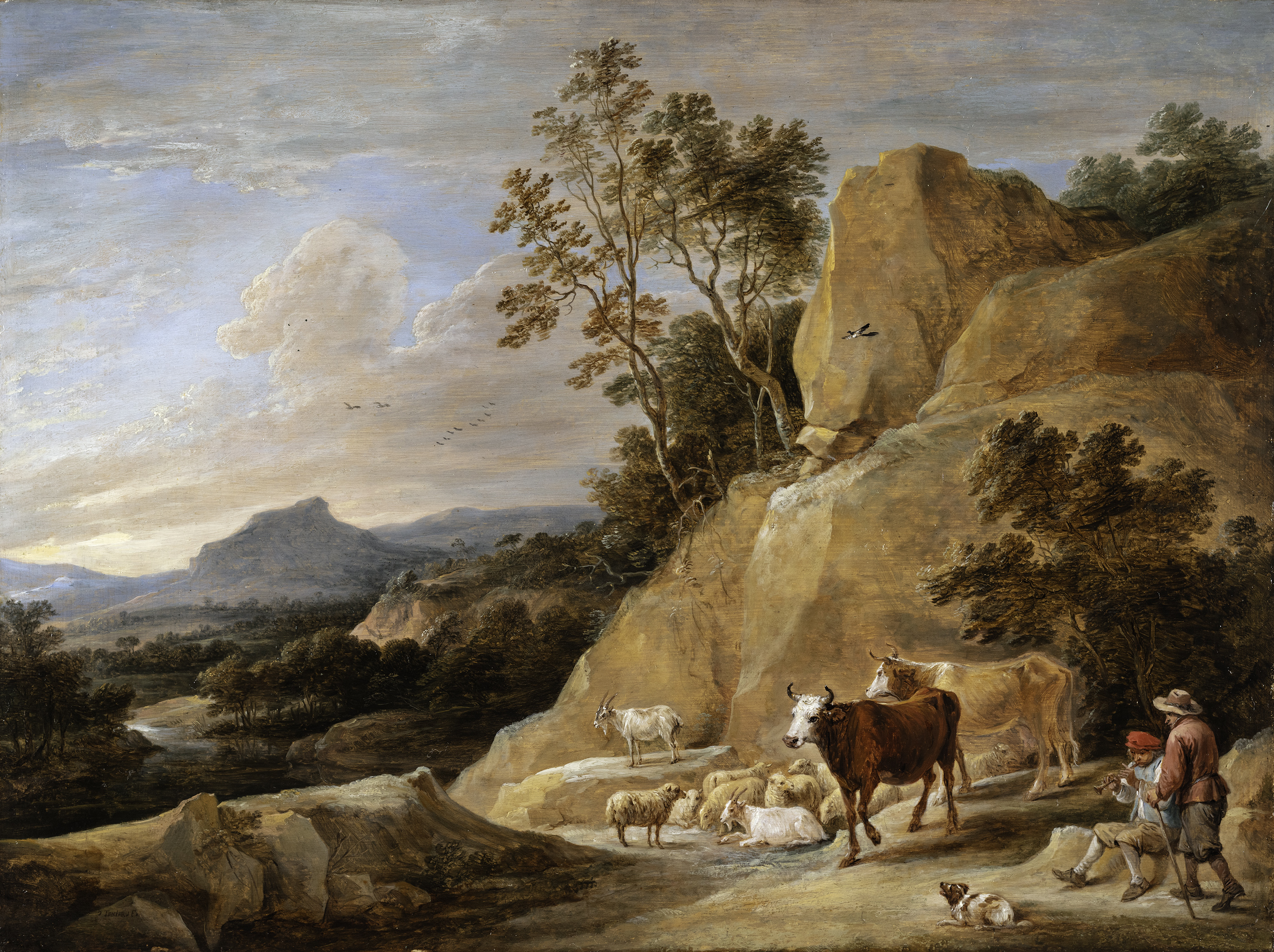 Herdsmen with their cattle in a mountainous landscape