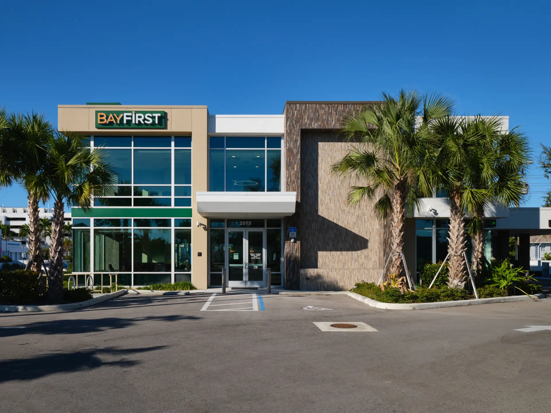 Bayfirst Bank commercial architecture building parking lot view. Designed by Suarez Architecture, Sarasota, FL