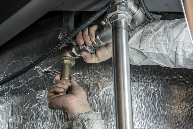 Plumber Conducting Plumbing Services