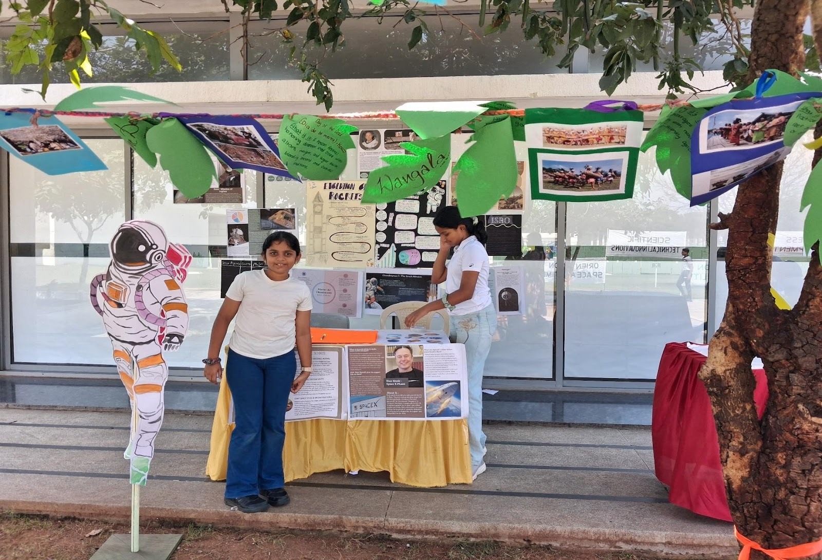 A group of people standing outside a boothAI-generated content may be incorrect.