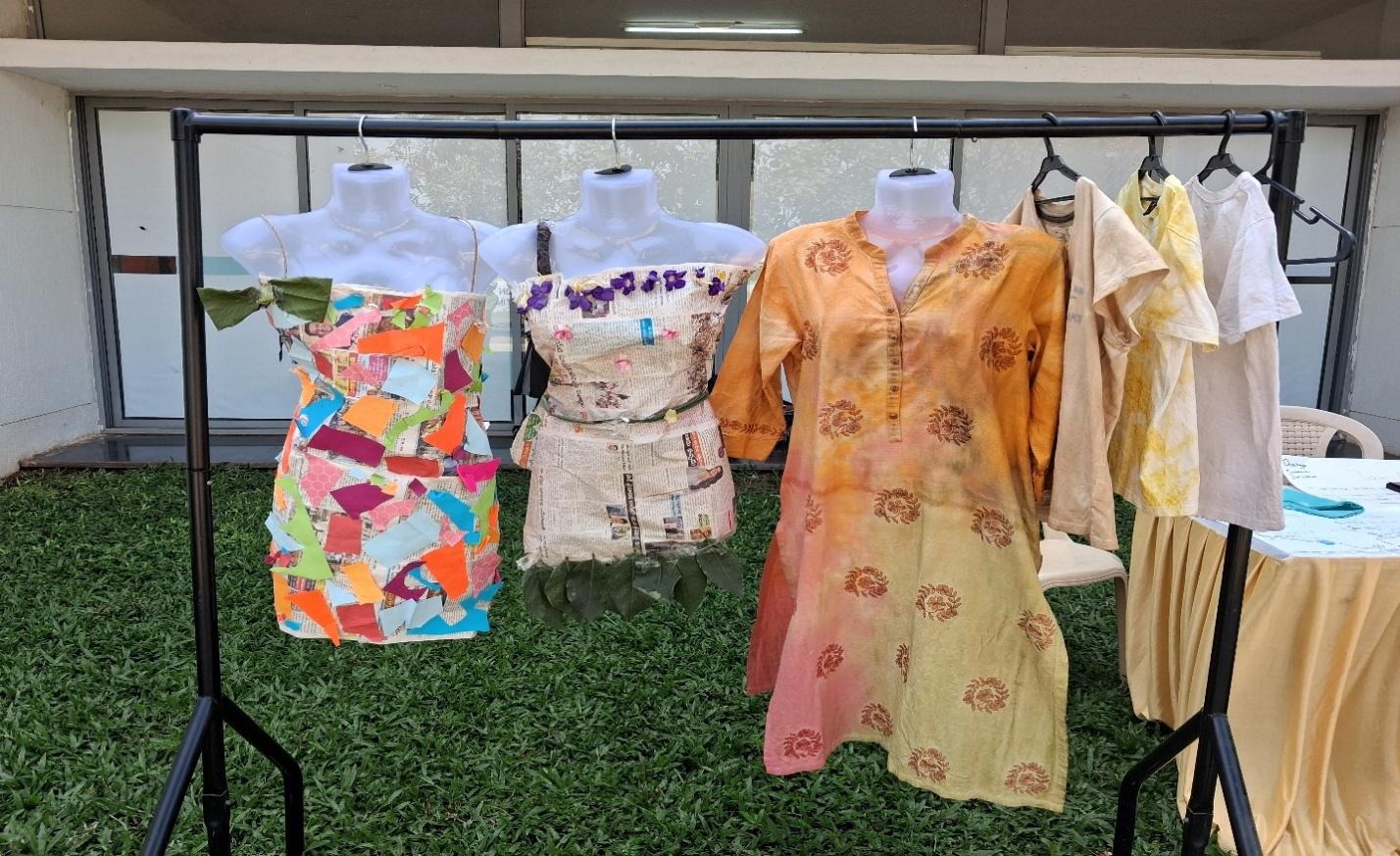 A group of mannequins with dresses on swingersAI-generated content may be incorrect.