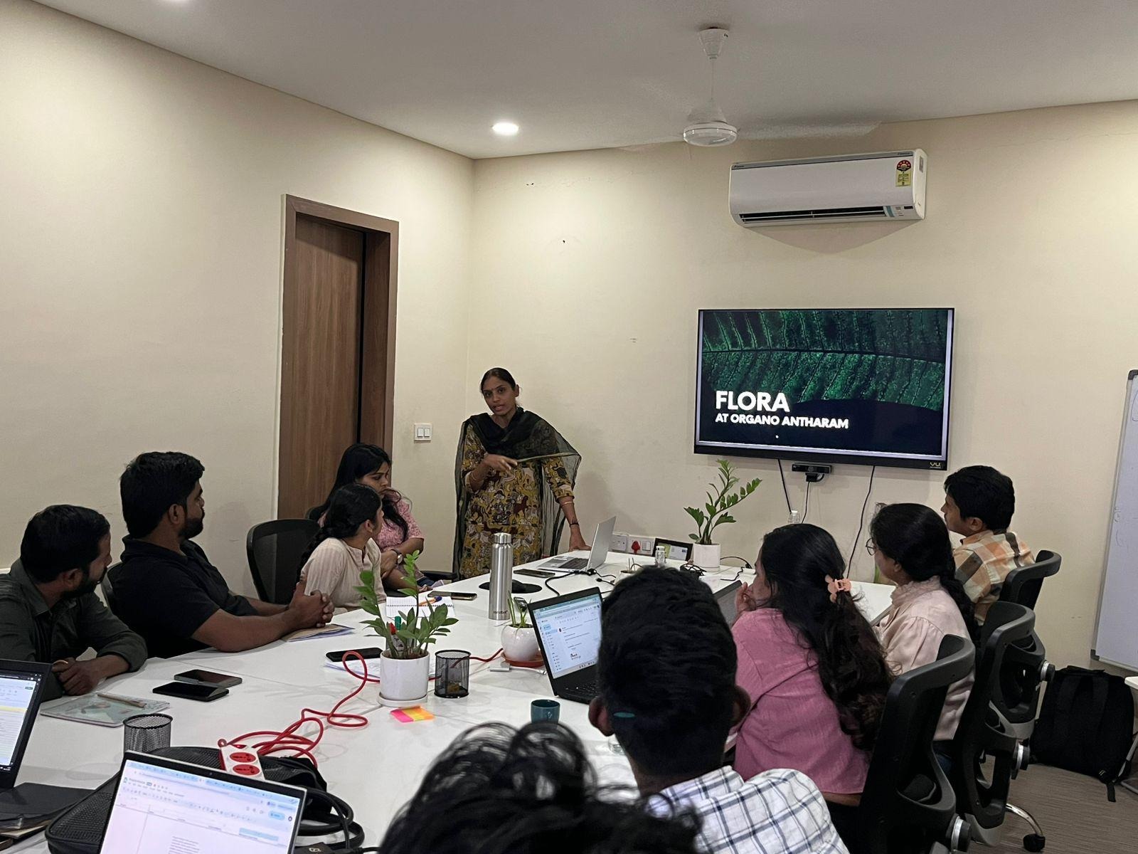 A group of people sitting around a tableAI-generated content may be incorrect.