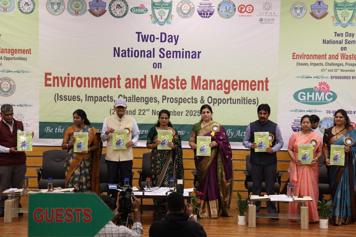 A group of people standing in front of a bannerAI-generated content may be incorrect.