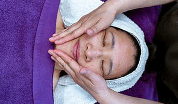 Woman having a holistic facial