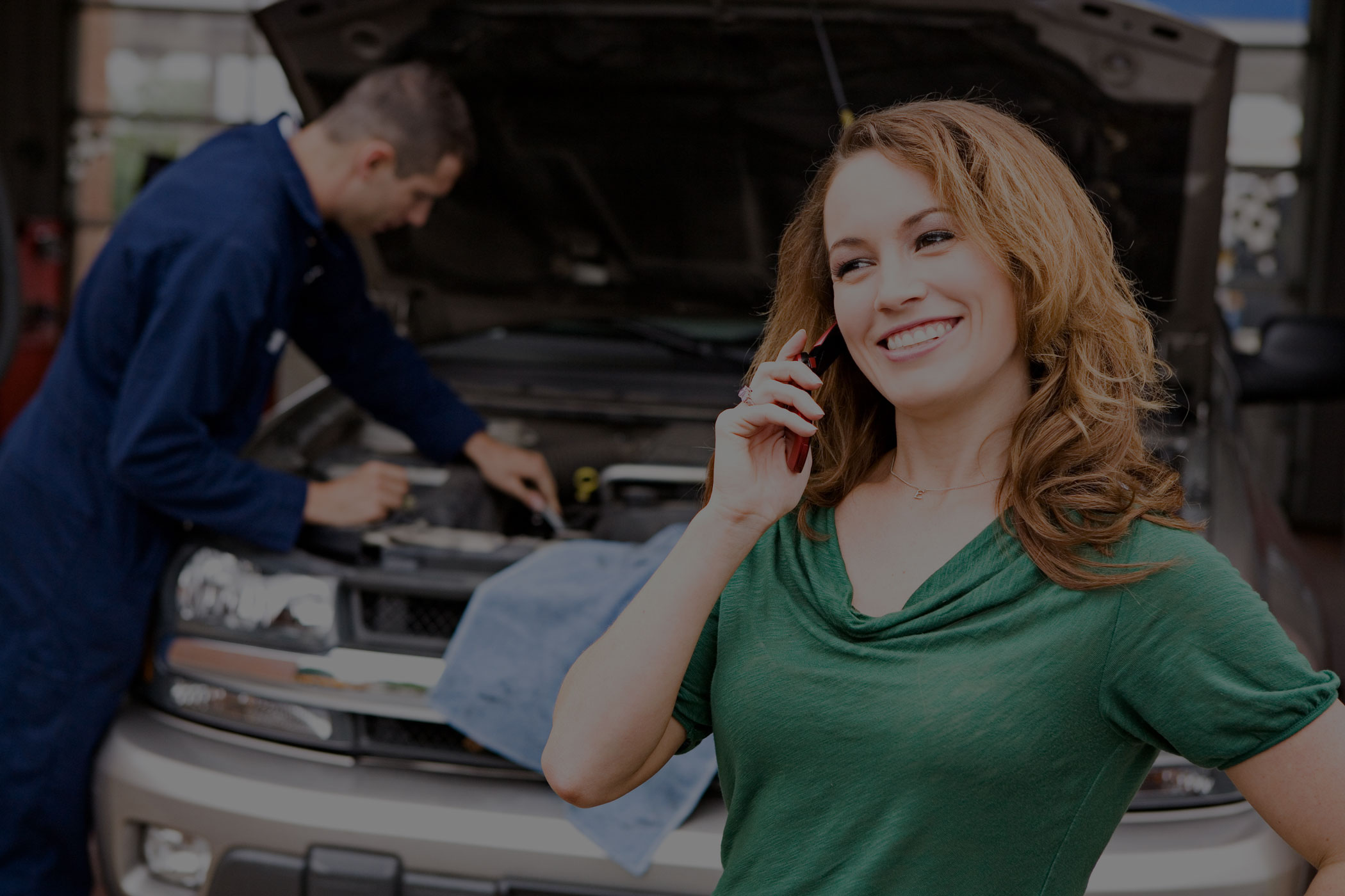 woman in garage talking on phone smiling