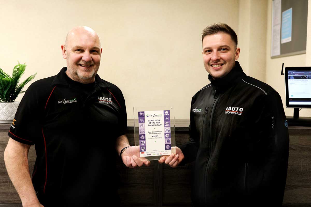 Graham and Steven Todd holding a certificate