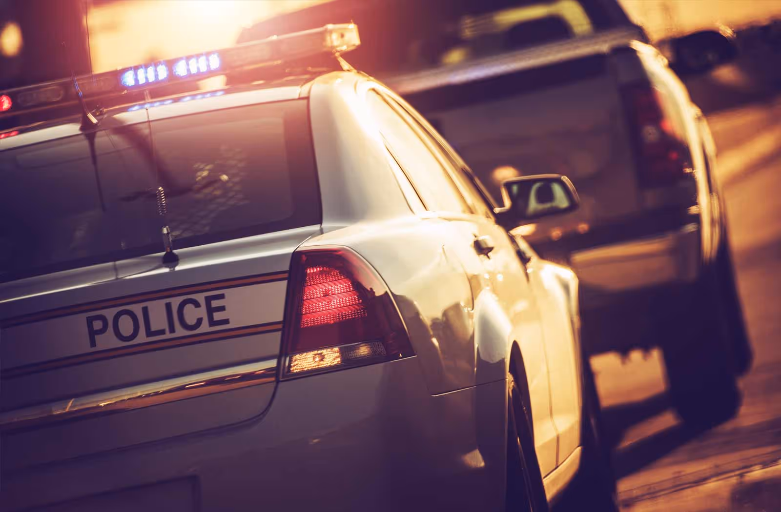 Police officer pulling over a car