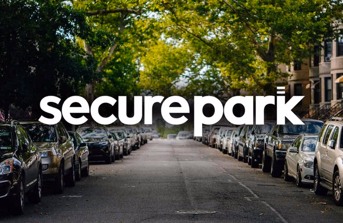 SecurePark logo overlaid on quiet street with parked cars