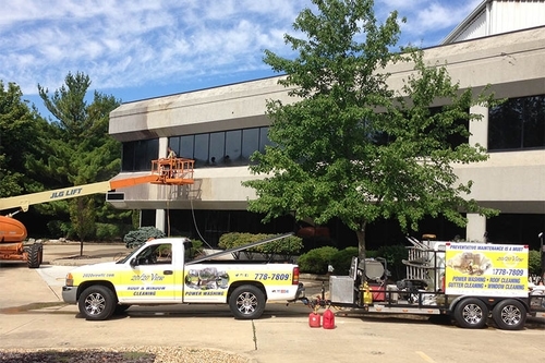 Washing the windows for an office using truck lift in Columbus, OH