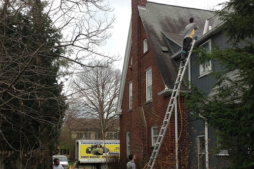 washing the roof of a residential property