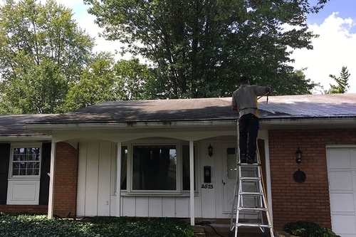 washing the roof of a residential property on a sunny day in Columbus, OH