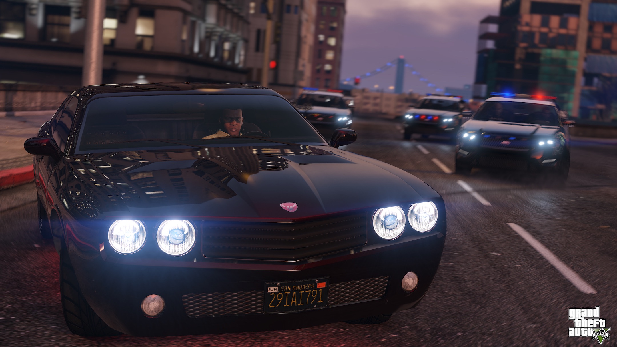 An action shot of a car chase, with Franklin at the head of a train of police cars.