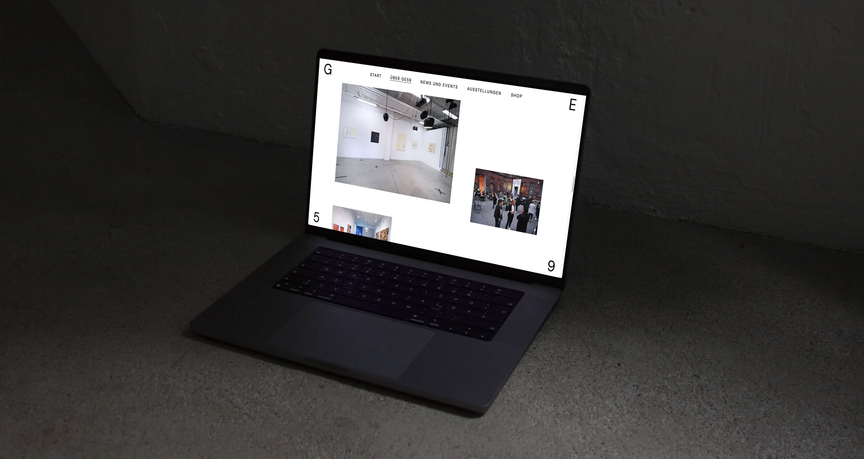 The GE59 gallery website on a laptop screen.