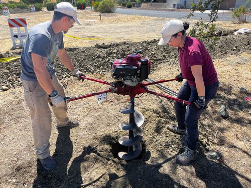 Workers constructing a community garden