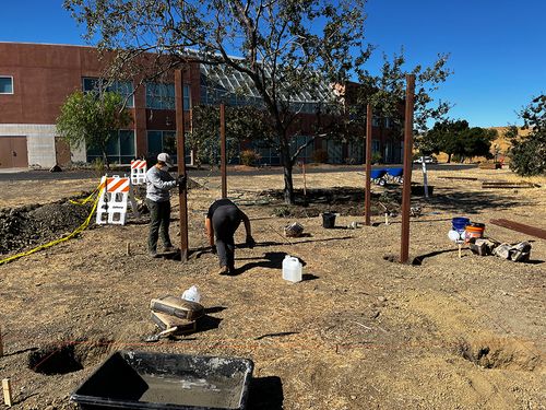 Workers constructing a community garden
