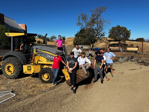Workers constructing a community garden