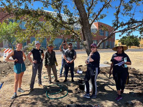 Workers constructing a community garden