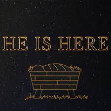 3 lit candles , with a sign saying "Thankful