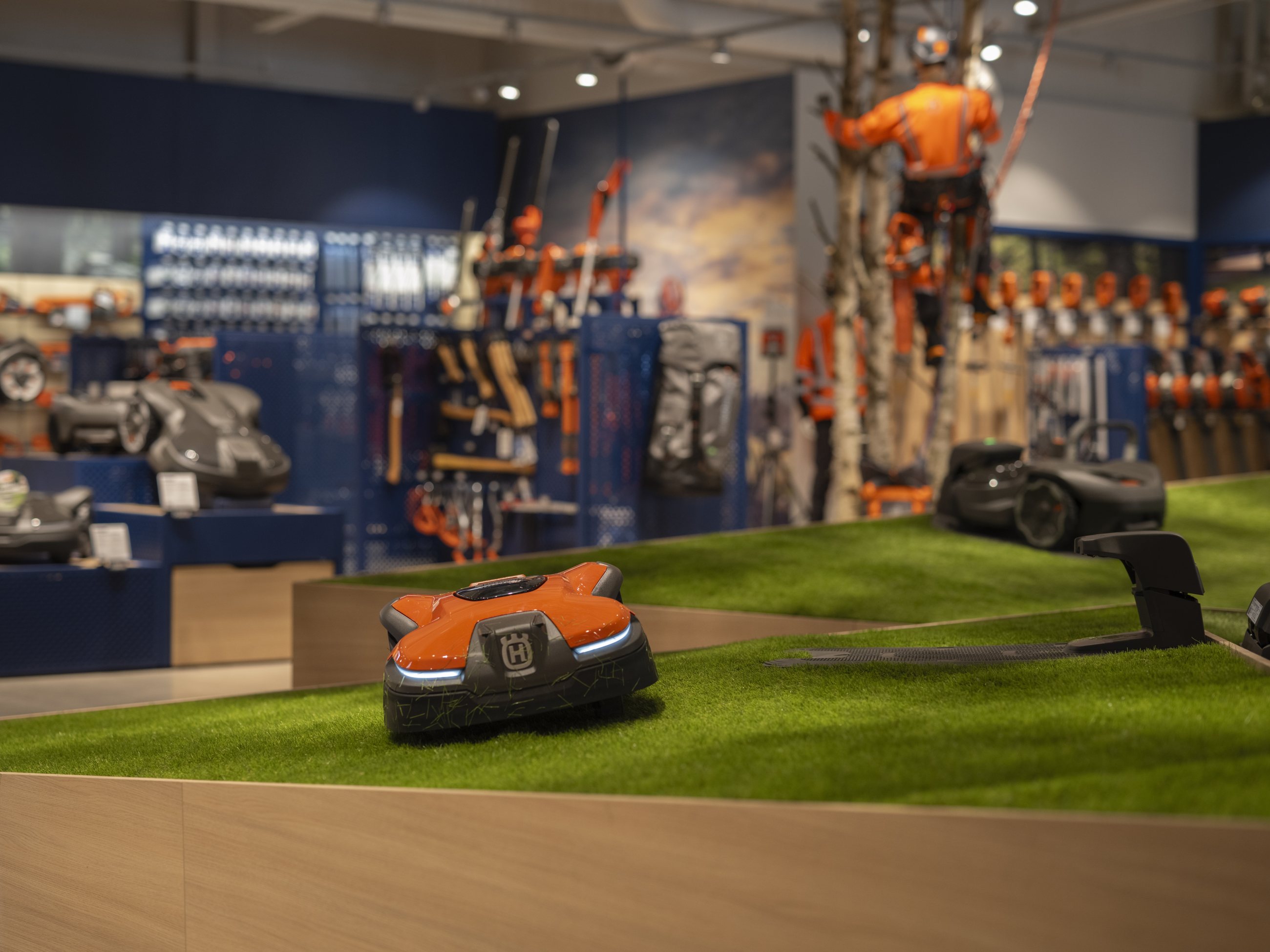 Robotic mowers on a turf display in a Husqvarna store