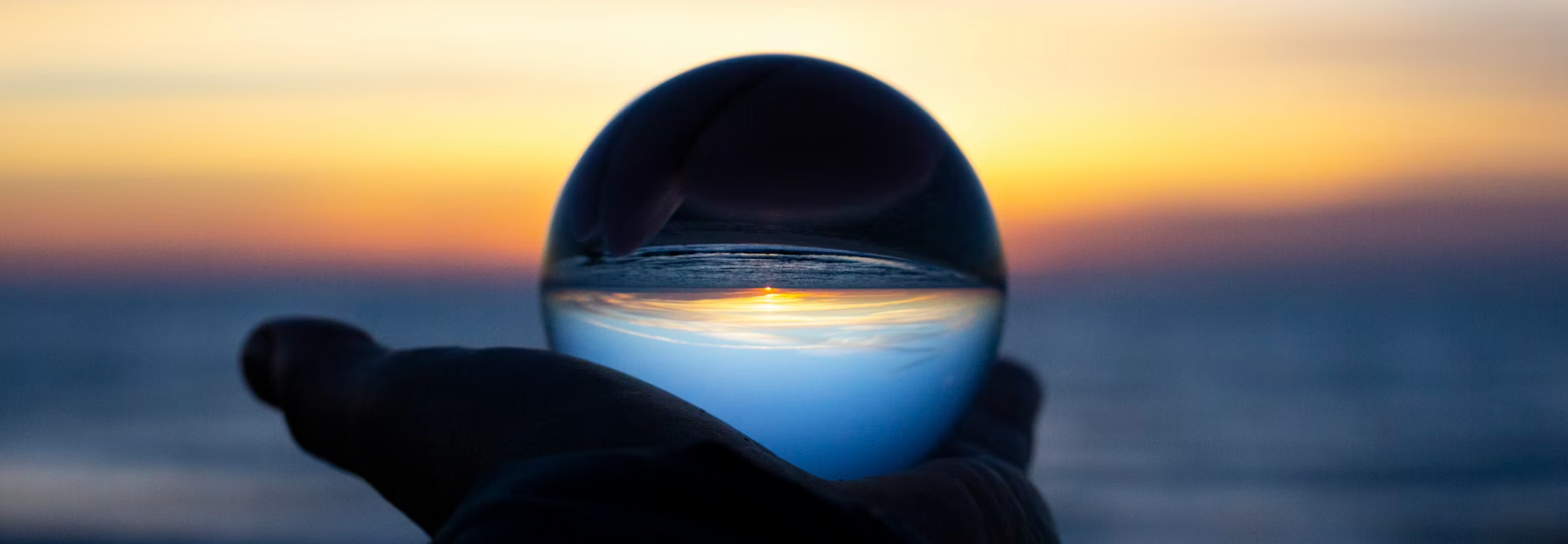 person holding clear glass glass