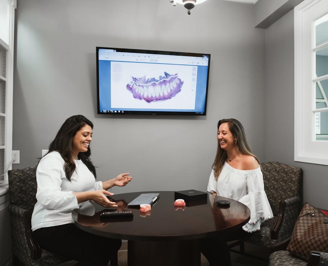 Photo of a team member and a patient bumping elbows