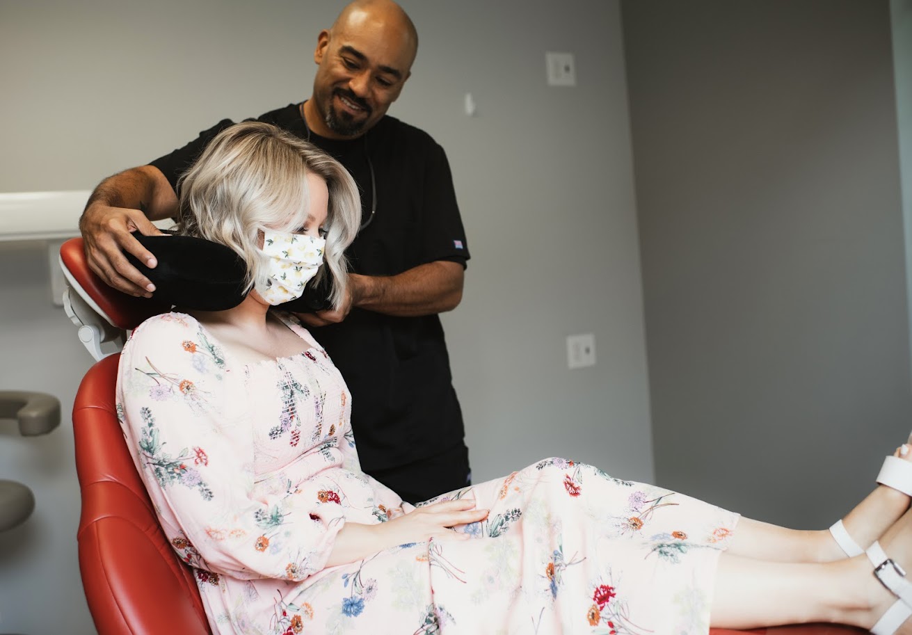 Photo of a team member and a patient bumping elbows