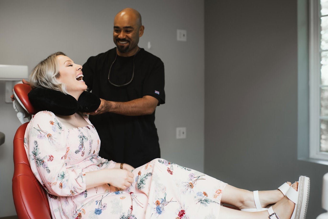 Photo of a team member and a patient bumping elbows
