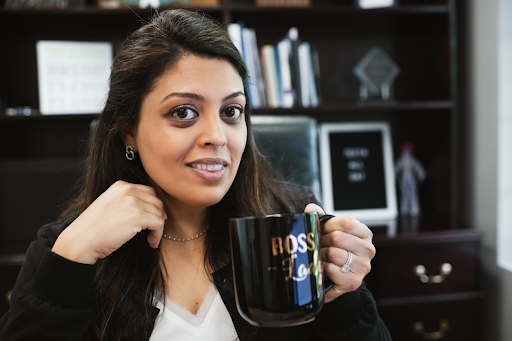 Photo of a team member and a patient bumping elbows