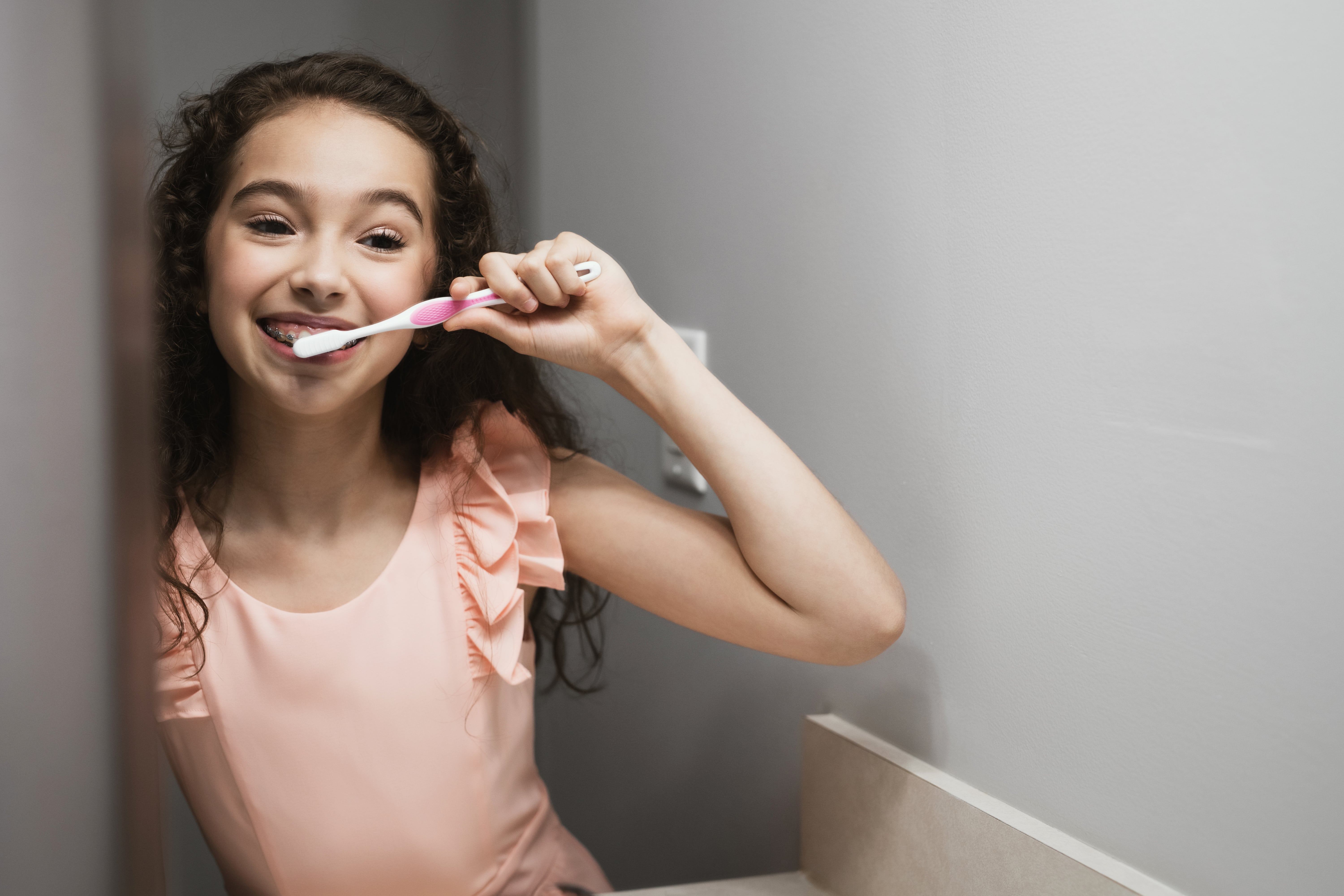 Photo of a team member and a patient bumping elbows