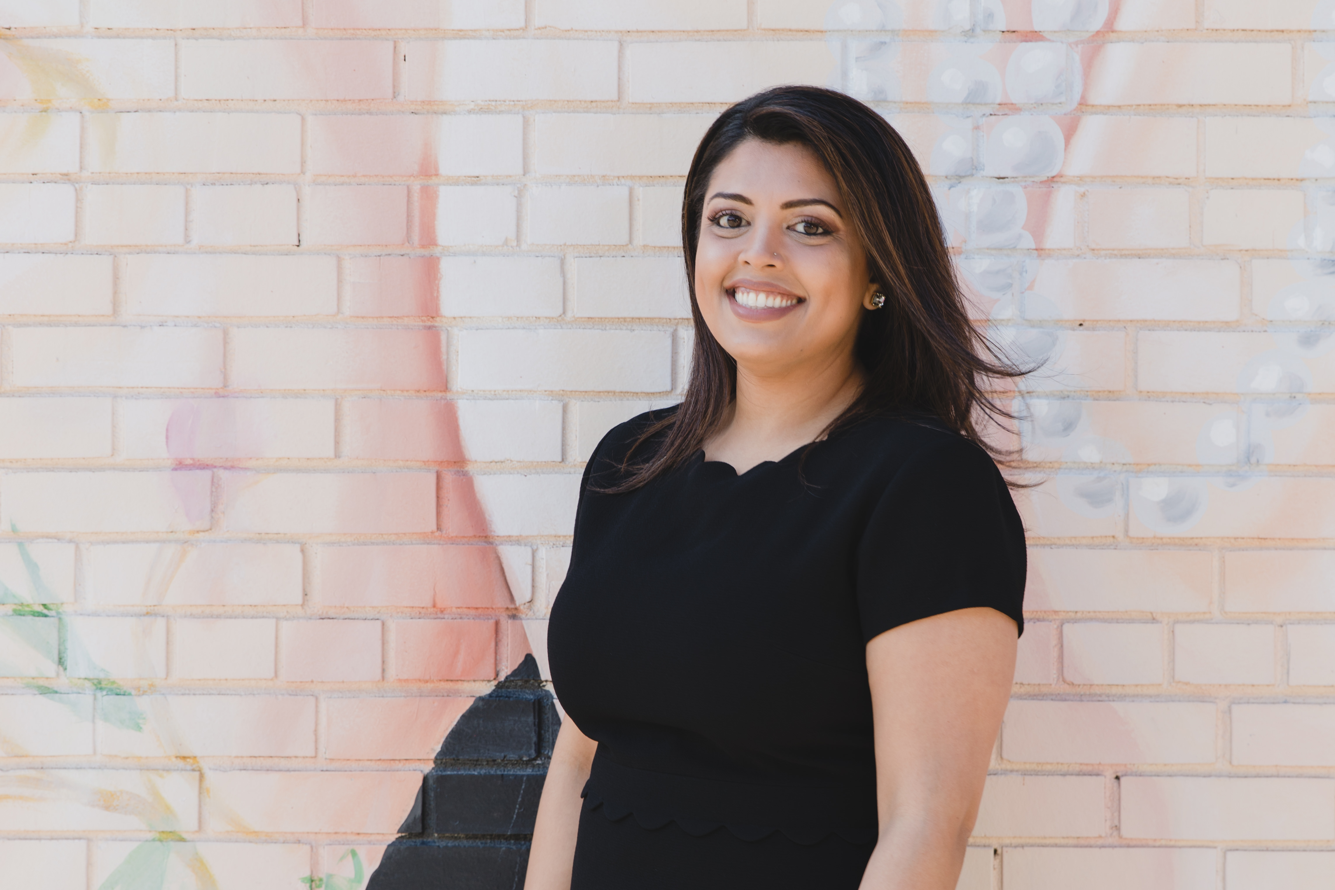 Photo of a team member and a patient bumping elbows