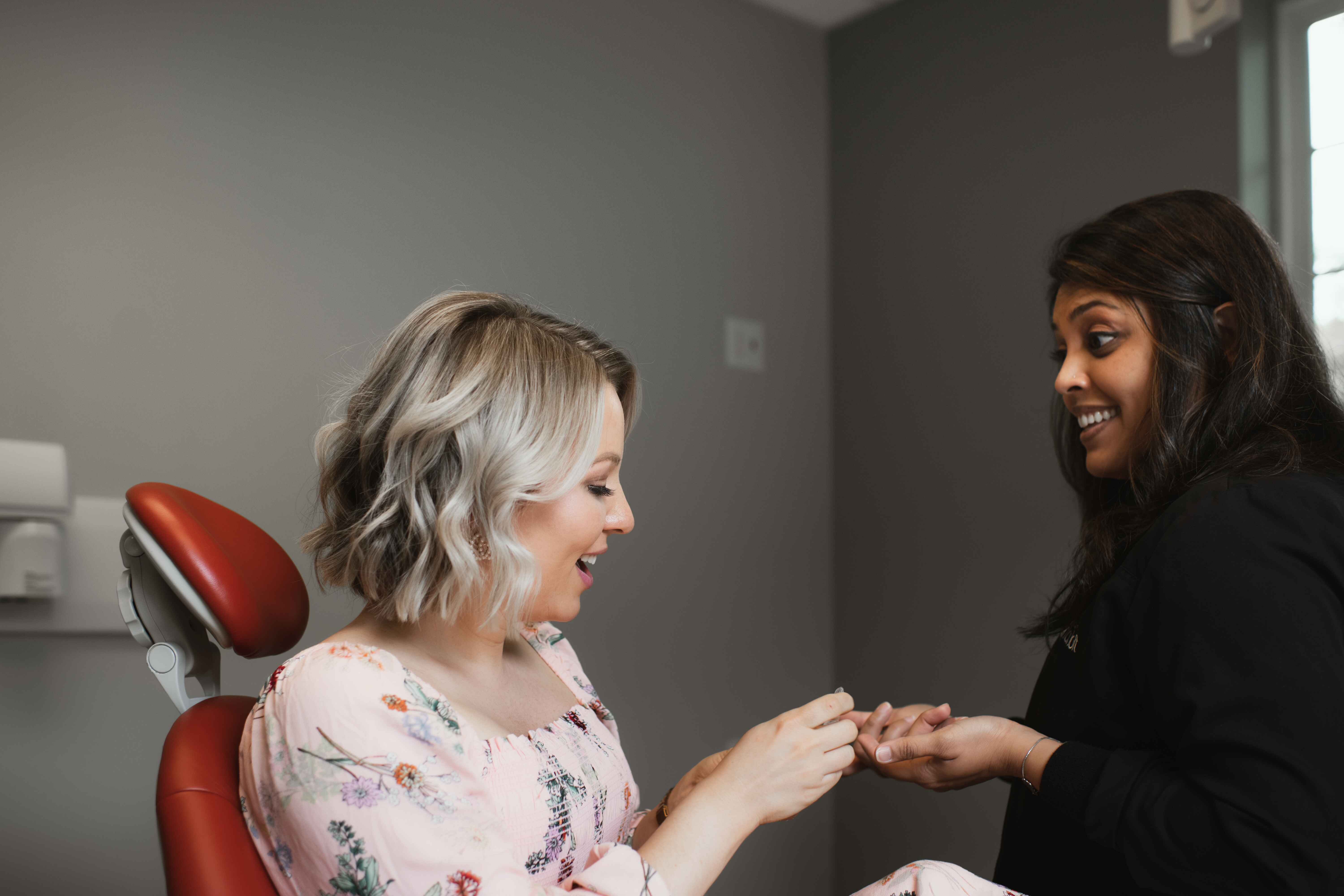 Photo of a team member and a patient bumping elbows