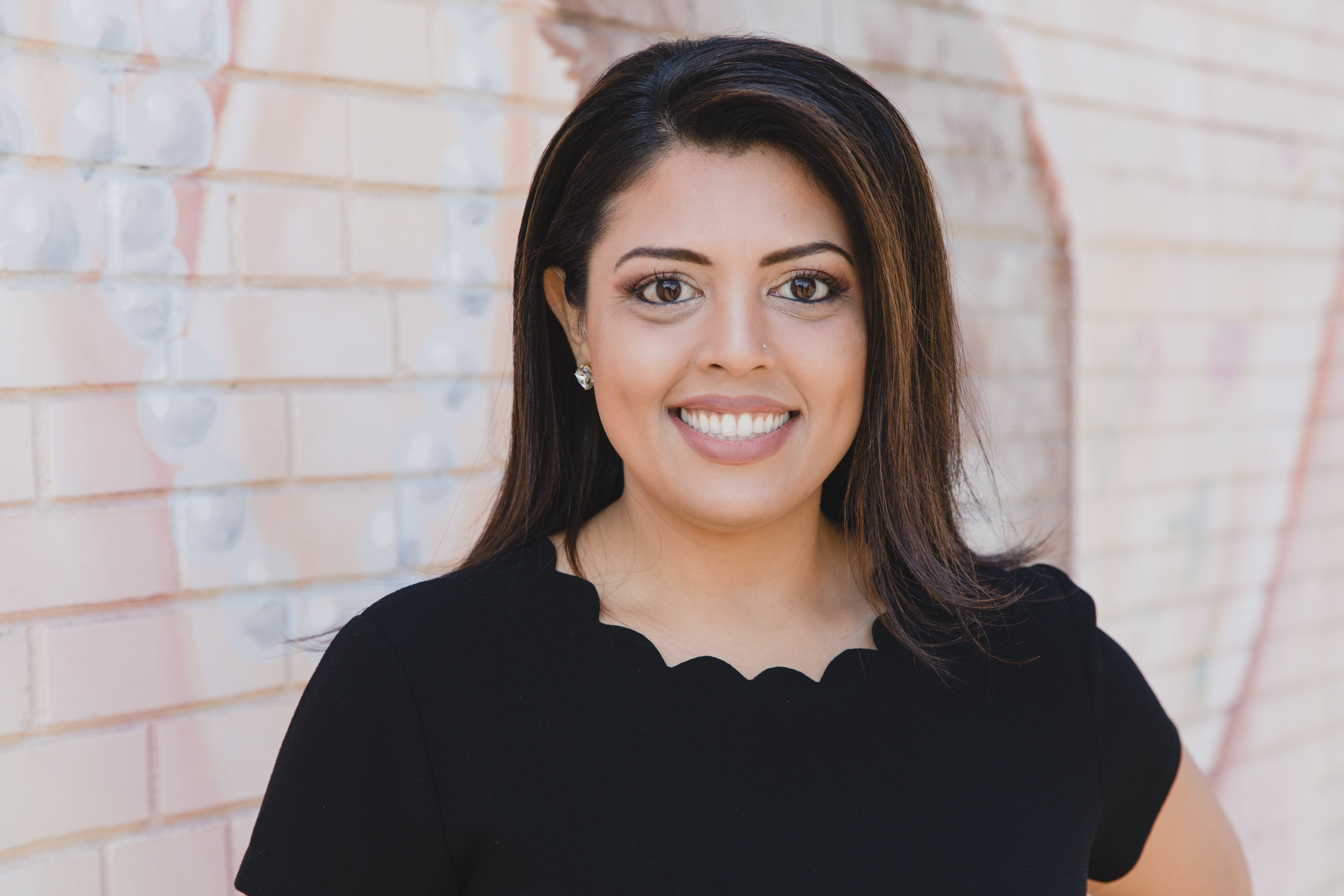 Photo of a team member and a patient bumping elbows