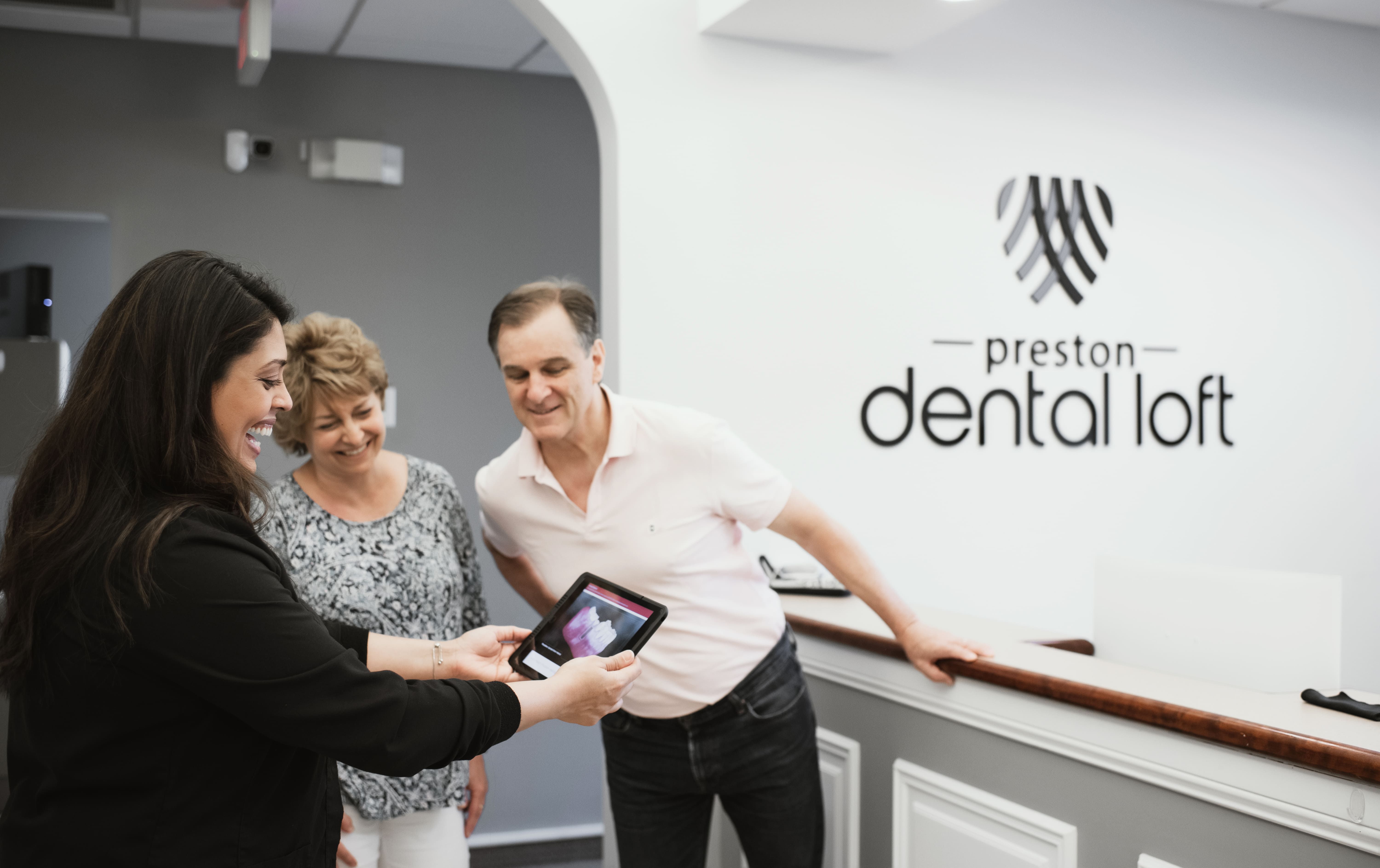 Photo of a team member and a patient bumping elbows