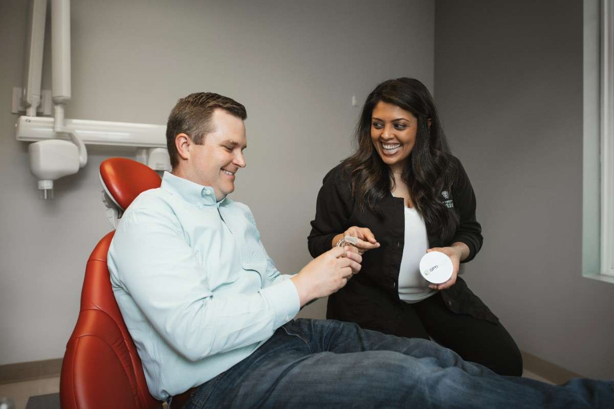 Photo of a team member and a patient bumping elbows