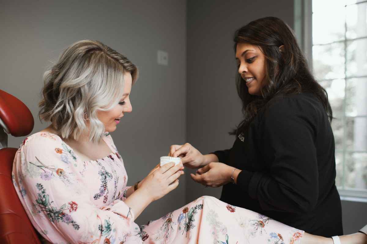 Photo of a team member and a patient bumping elbows