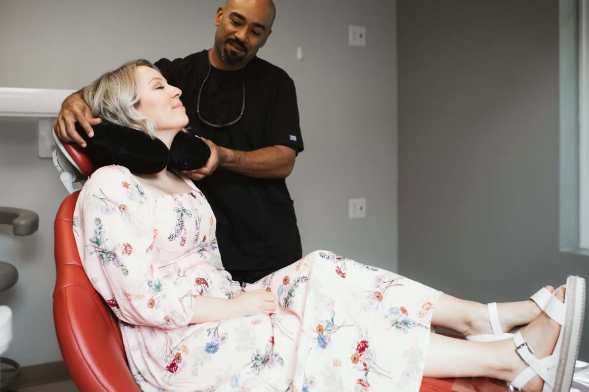 Photo of a team member and a patient bumping elbows