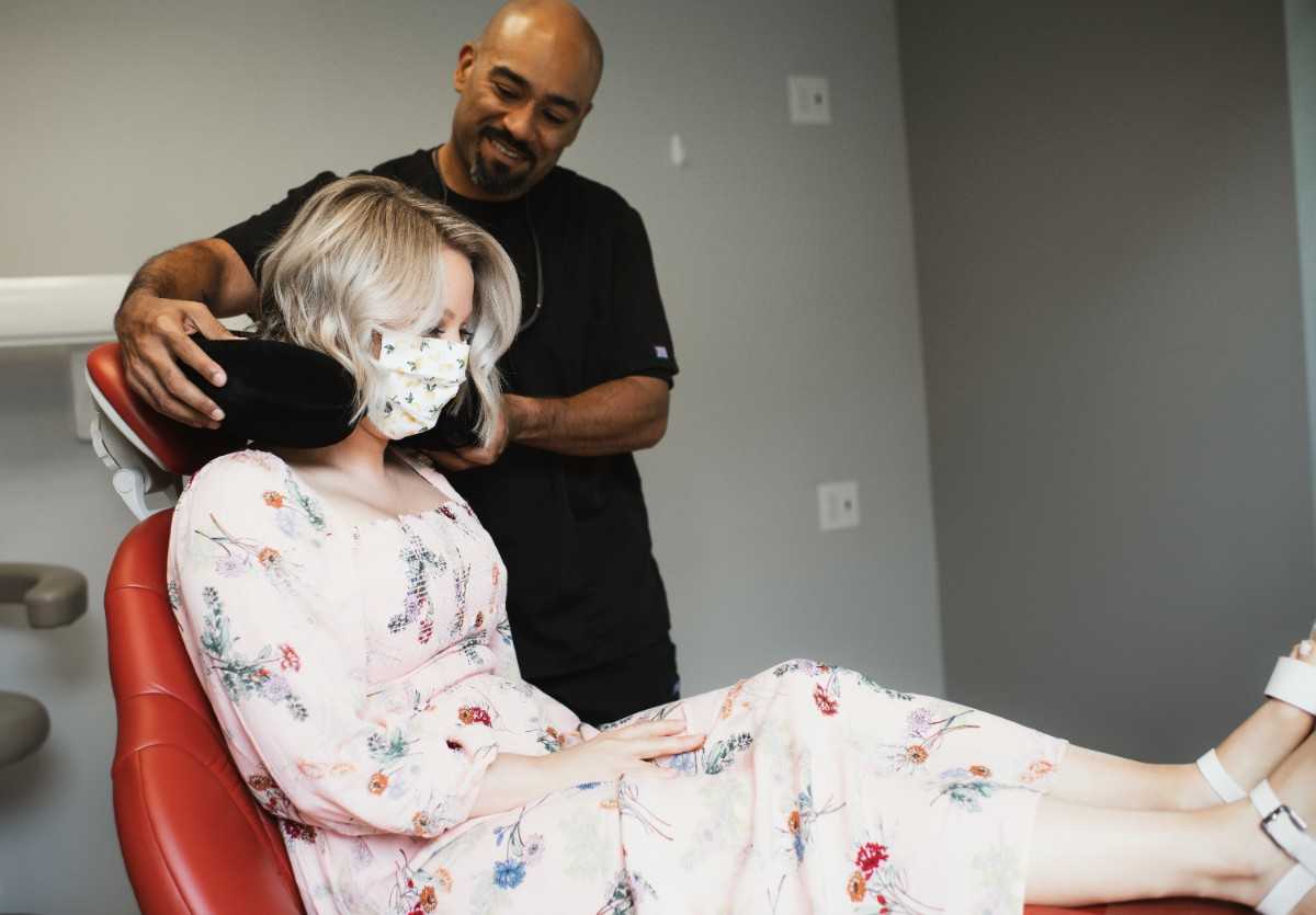 Photo of a team member and a patient bumping elbows