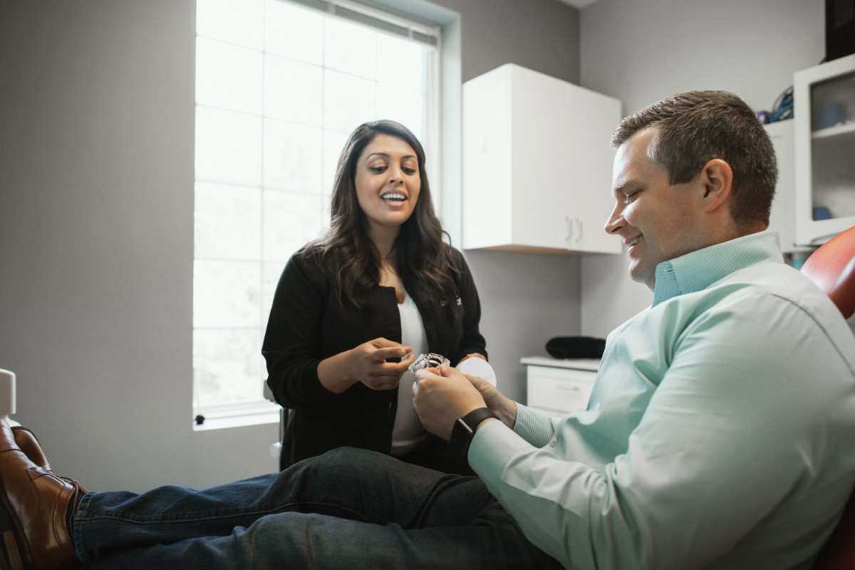 Photo of a team member and a patient bumping elbows