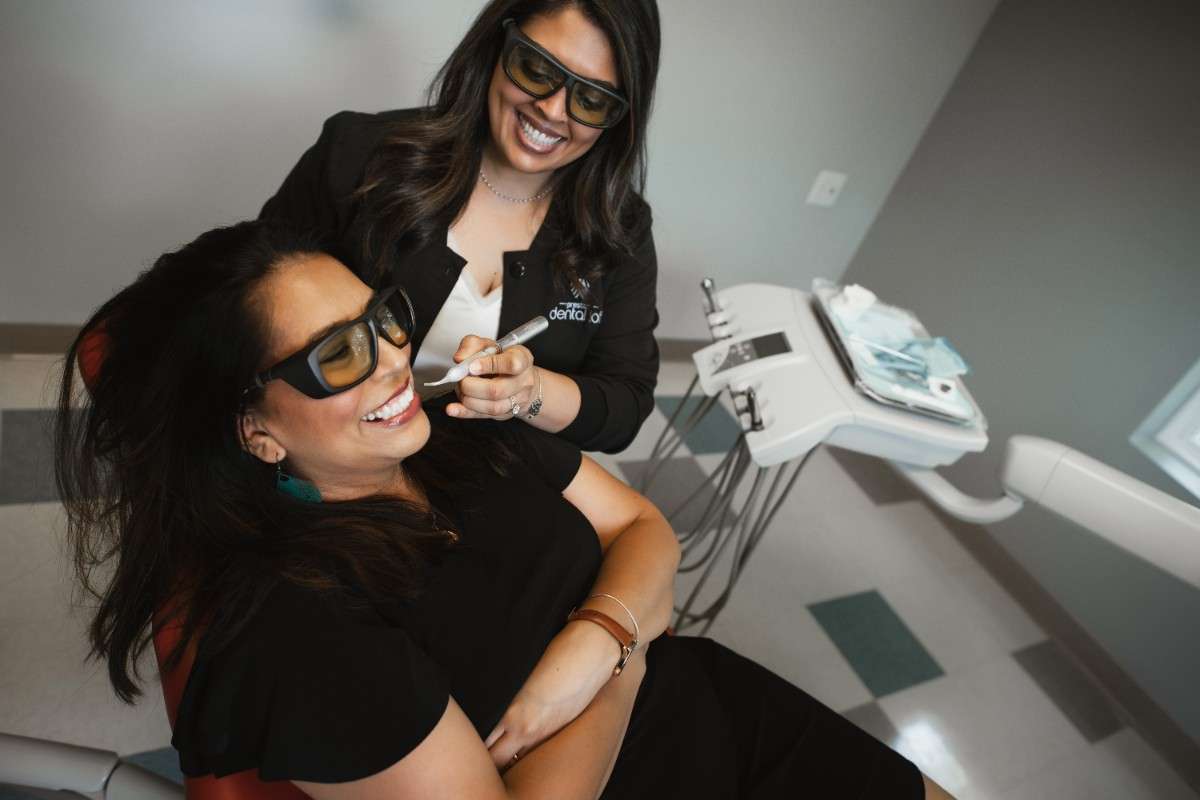 Photo of a team member and a patient bumping elbows