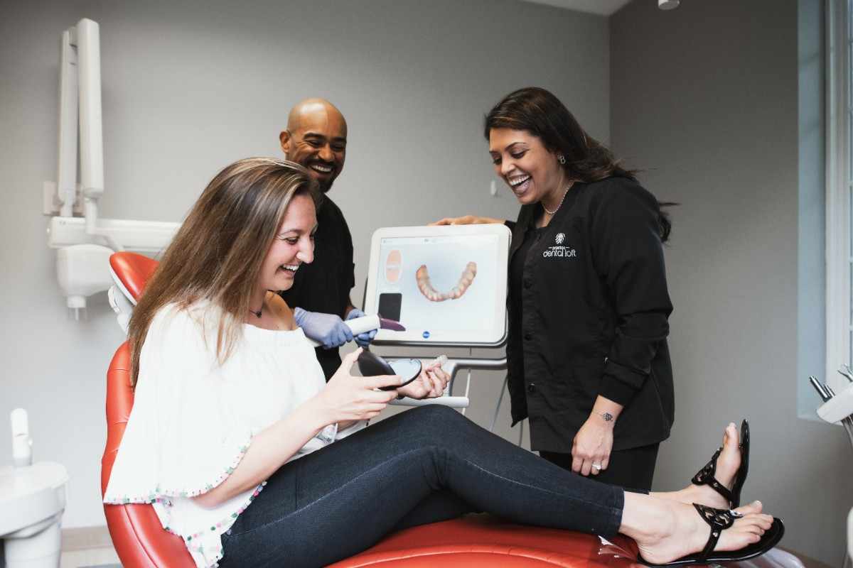 Photo of a team member and a patient bumping elbows