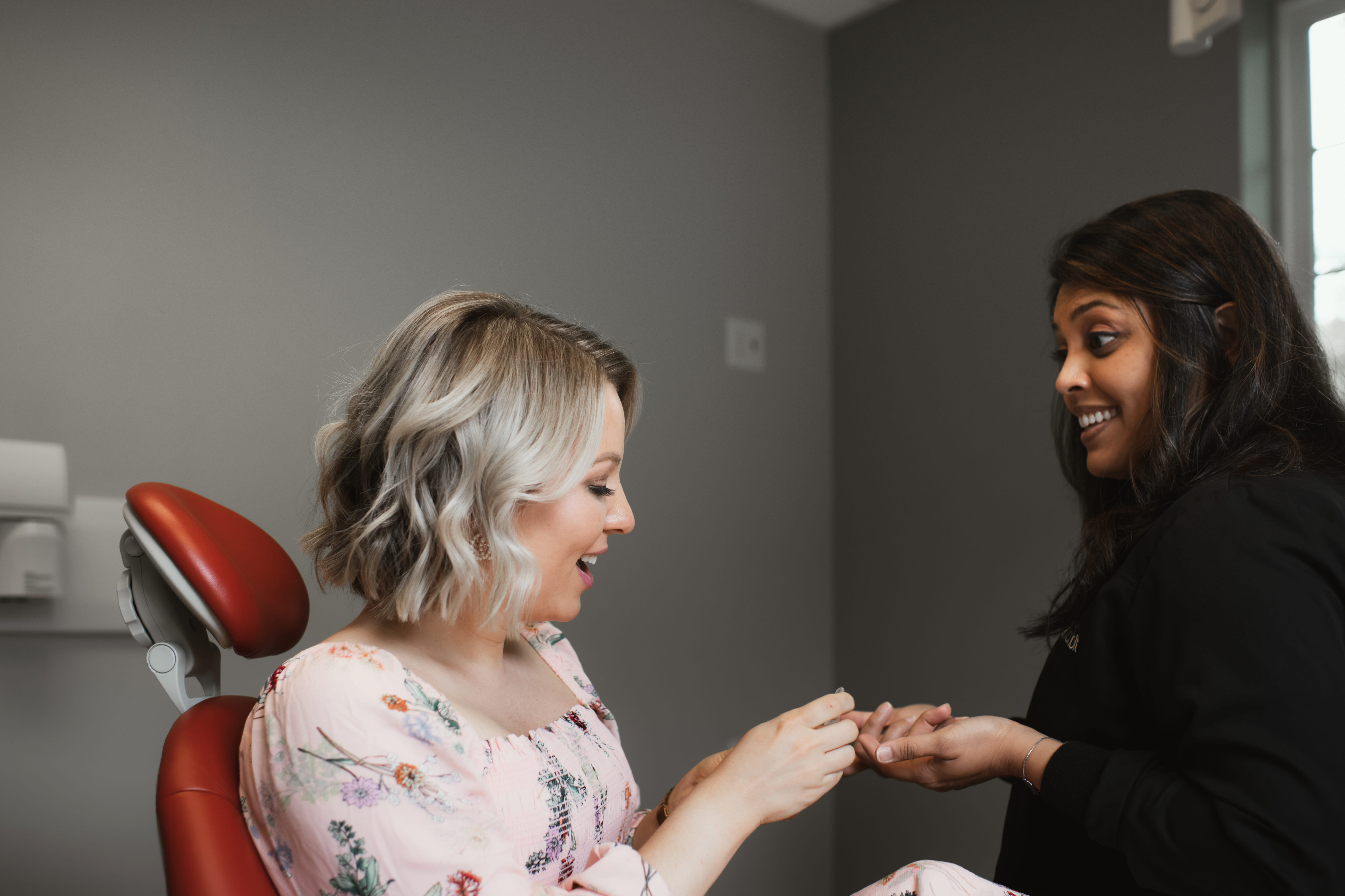 Photo of a team member and a patient bumping elbows