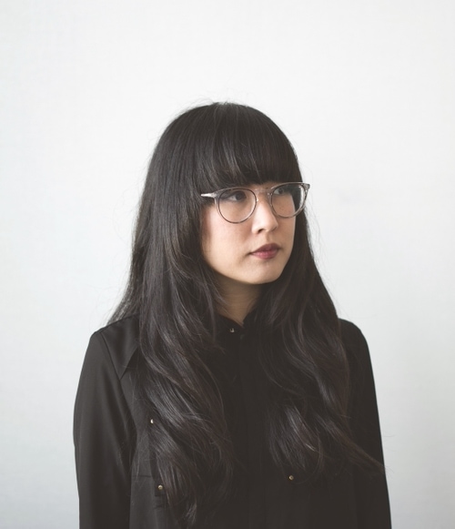 Profile ohoto of woman looking to the right.