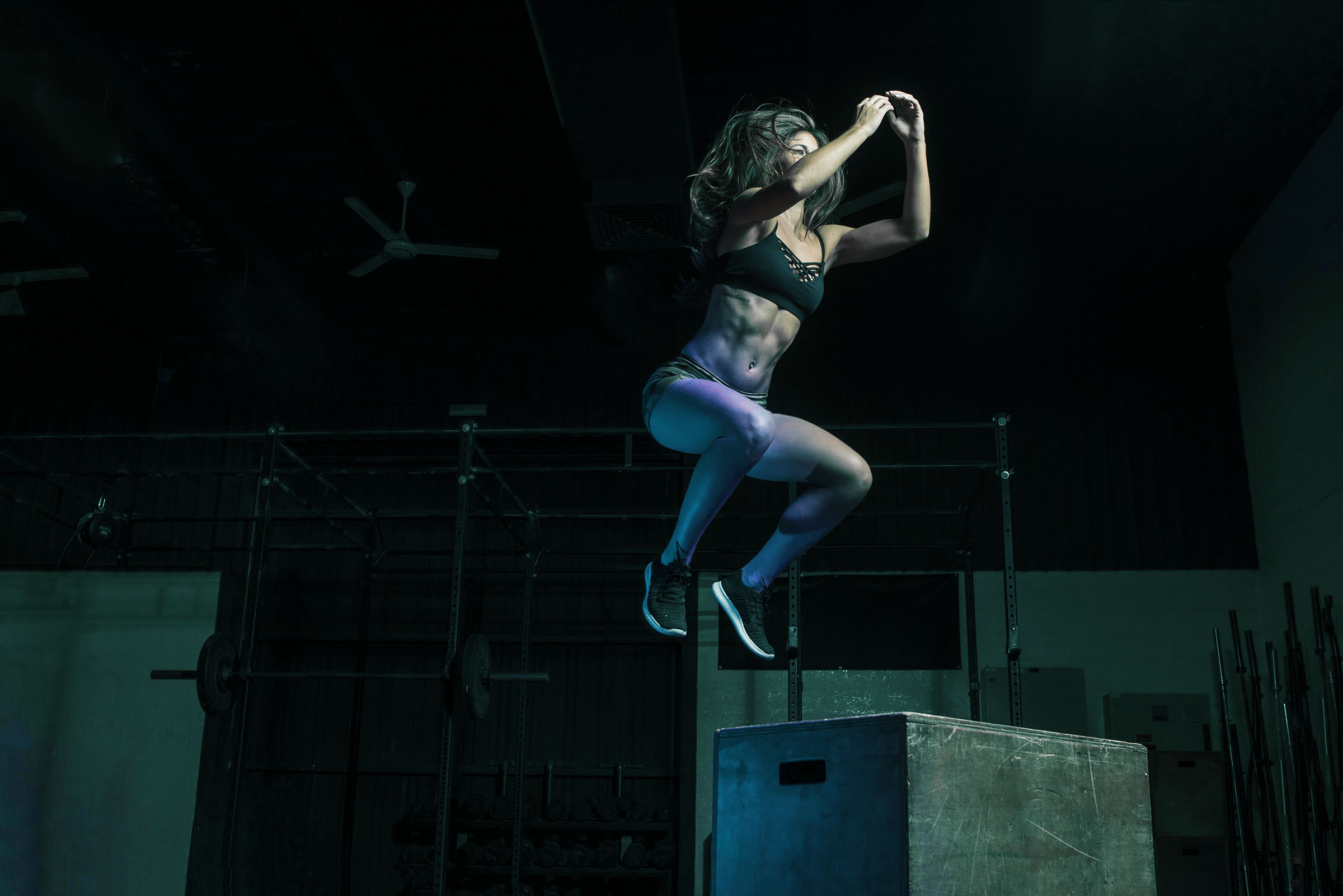 Woman jumping on a plyo box